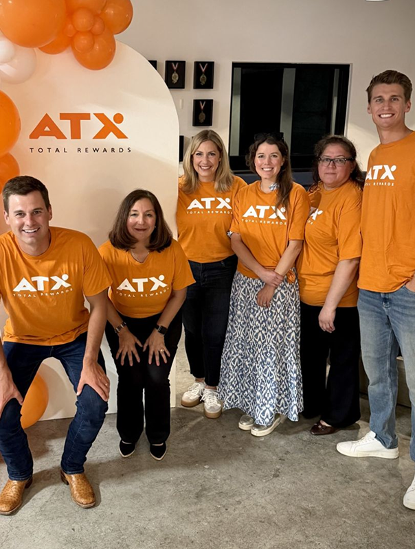 ATX Total Rewards team wearing branded shirts